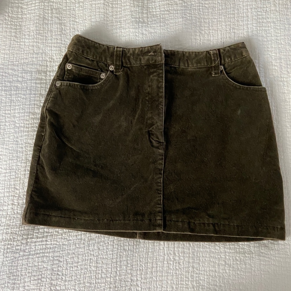 Short green corduroy skirt